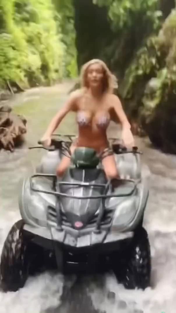 HANNAH PALMER rides an ATV through a waterfall in Bali #shorts