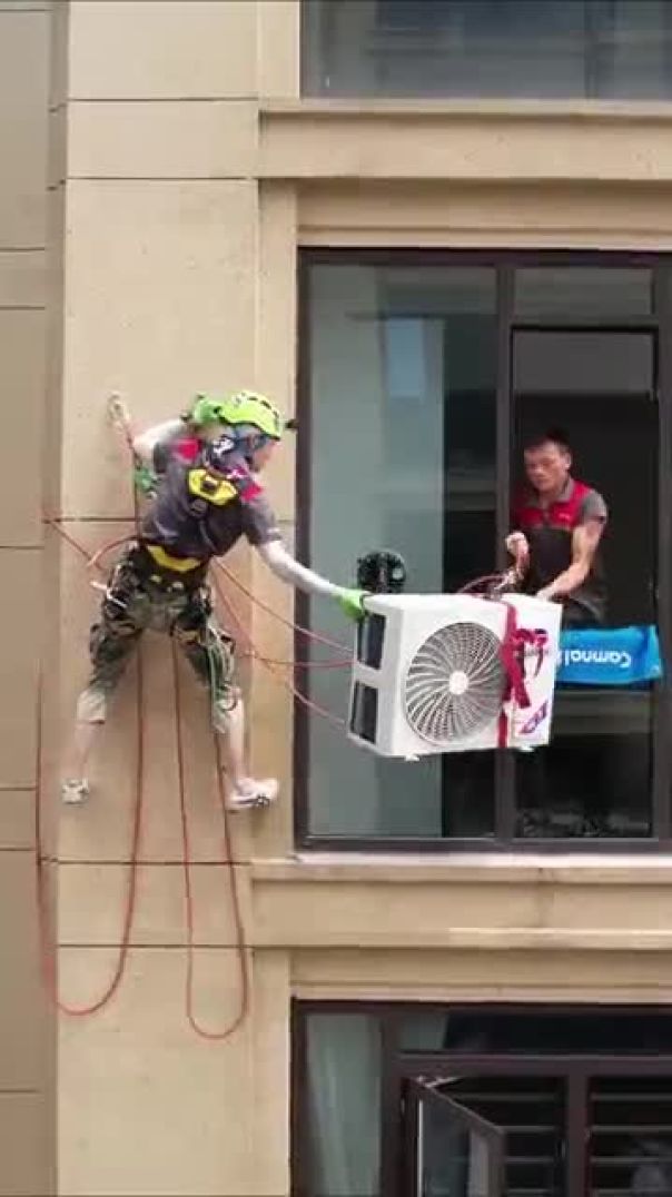 Cool spider man technique installing an air conditioner on an exterior wall #craftsman #spiderman