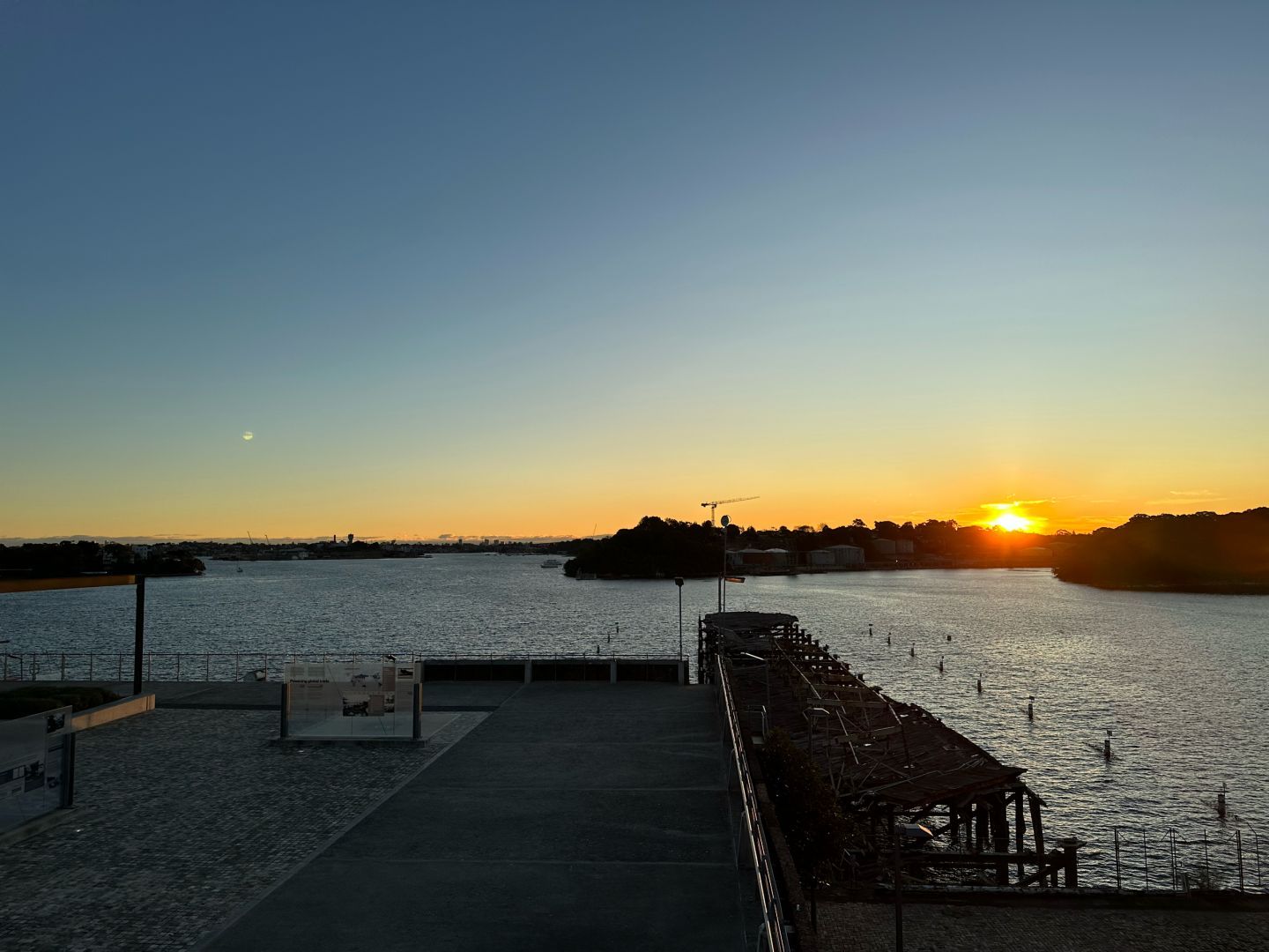 Sun setting over Sydney Harbour, looking west from Balls Head