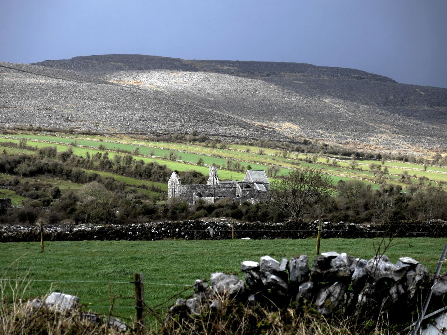 Ruin of an old church, a very rocky landscape in the background.
The Burren, County Clare